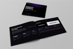 Mockup of the Ventanix Design System brochure shown as two booklets on a light gray surface. The cover is black with a purple gradient glow and large white bold text reading 'DESIGN SYSTEM,' labeled version 1.0, updated June 2026, maintained by Ventanix Creative. The open booklet shows two spreads: a left 'The Brand' page headed 'Moving Brands Forward,' describing Ventanix as a full-service creative and marketing agency, with stat blocks reading 3,500+ projects delivered, 20+ years experience, and 98% client satisfaction, plus three brand principles—Confident, Useful, and Built to convert. The right 'Logo' page is titled 'The Wordmark,' showing the VENTANIX logo in white on black and black on white, with the final X carrying a gold gradient, alongside guidance on clear space, the gold X, source files, and logo don'ts.